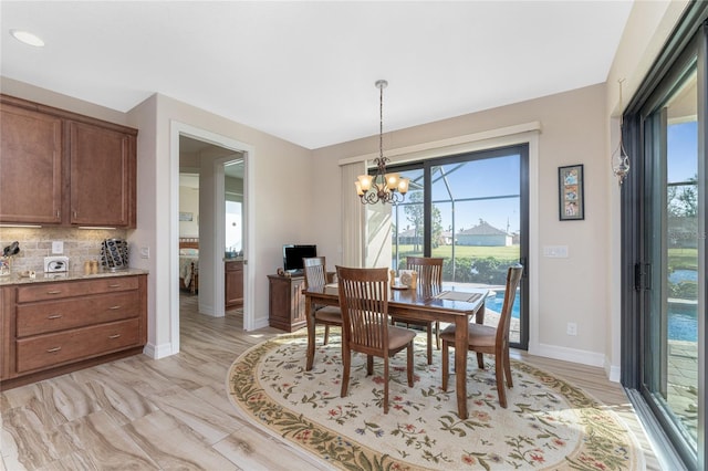 dining space with an inviting chandelier and a wealth of natural light