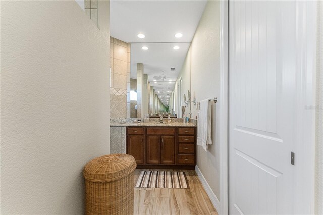 bathroom featuring vanity and wood-type flooring