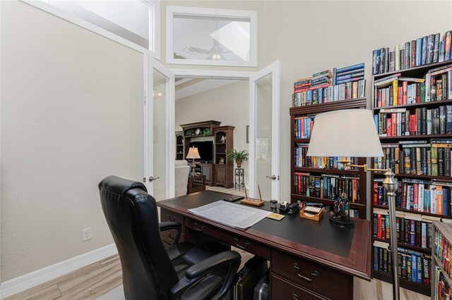 office space with light hardwood / wood-style floors