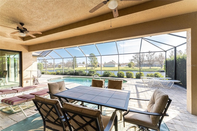 view of patio / terrace with glass enclosure and ceiling fan