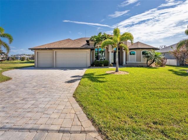 view of front facade featuring a front lawn and a garage