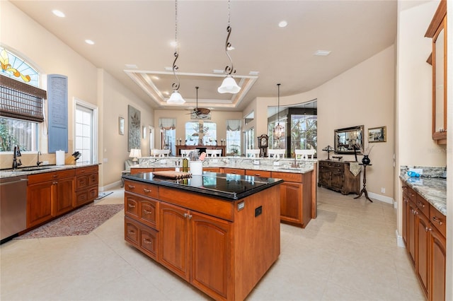 kitchen featuring a wealth of natural light, dishwasher, pendant lighting, and a kitchen island