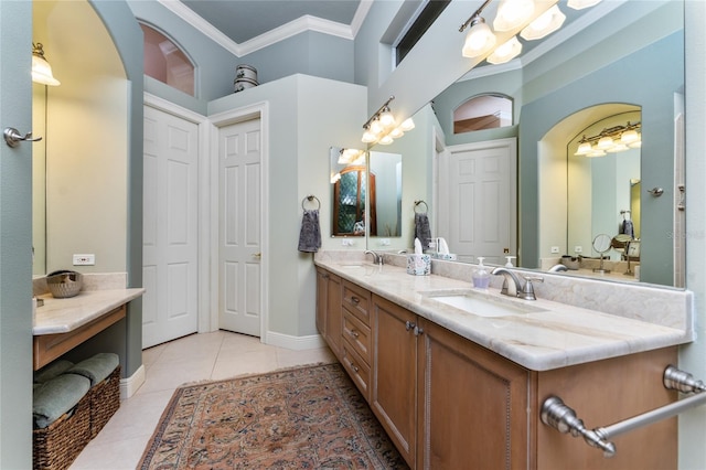 bathroom featuring tile patterned flooring, vanity, and crown molding