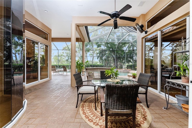 sunroom featuring ceiling fan