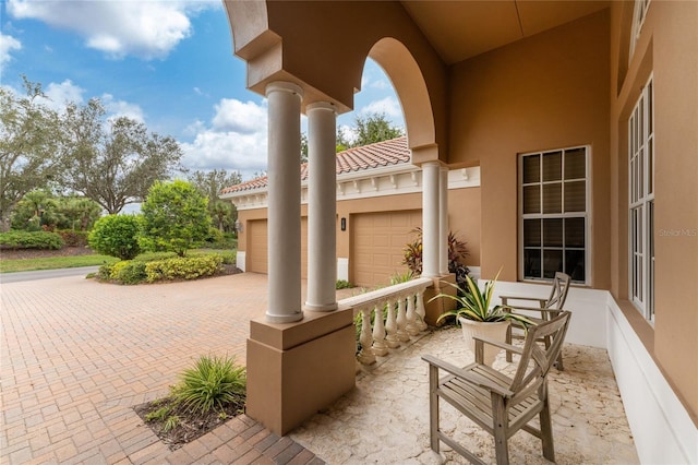 view of patio featuring a garage