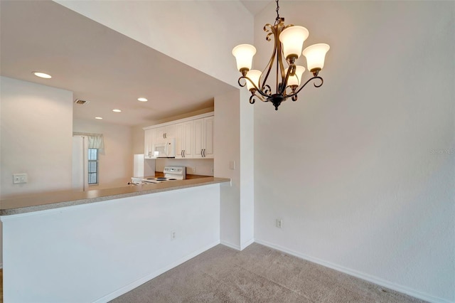 kitchen featuring light carpet, white cabinets, an inviting chandelier, decorative light fixtures, and white appliances