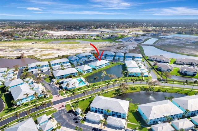 birds eye view of property with a water view