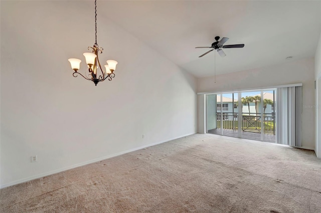 empty room with carpet, ceiling fan with notable chandelier, and high vaulted ceiling