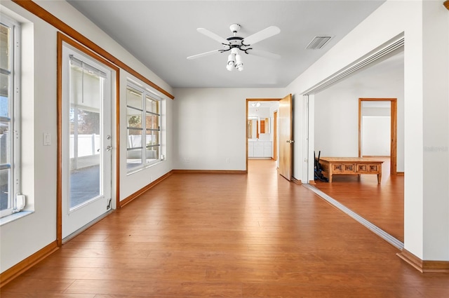 spare room featuring light hardwood / wood-style flooring and ceiling fan