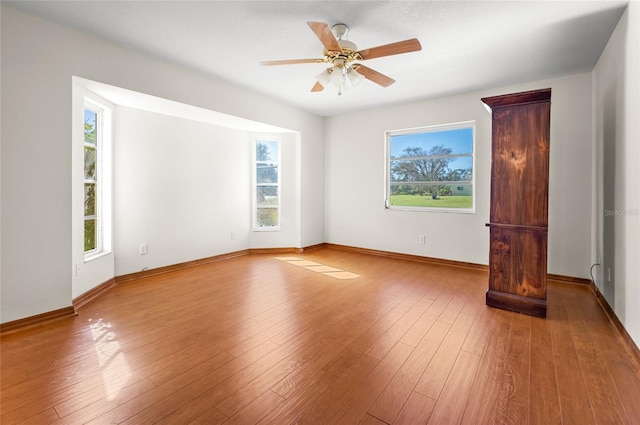 unfurnished room featuring light hardwood / wood-style flooring and a healthy amount of sunlight