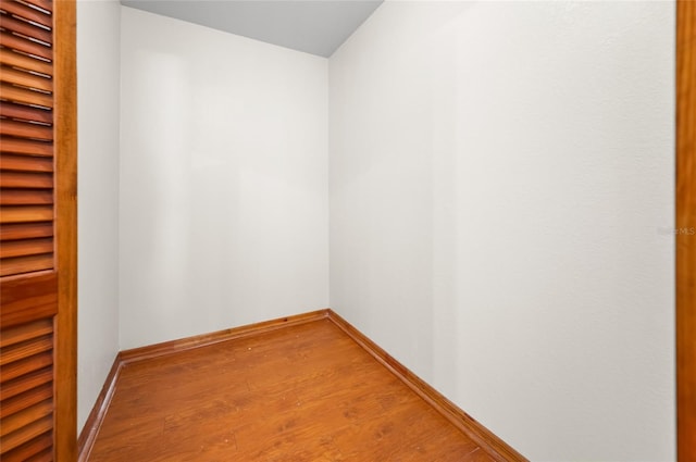 unfurnished room with hardwood / wood-style flooring