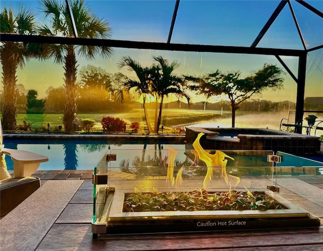 pool at dusk with a patio