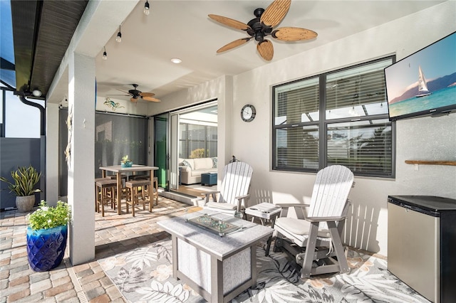 view of patio / terrace featuring ceiling fan