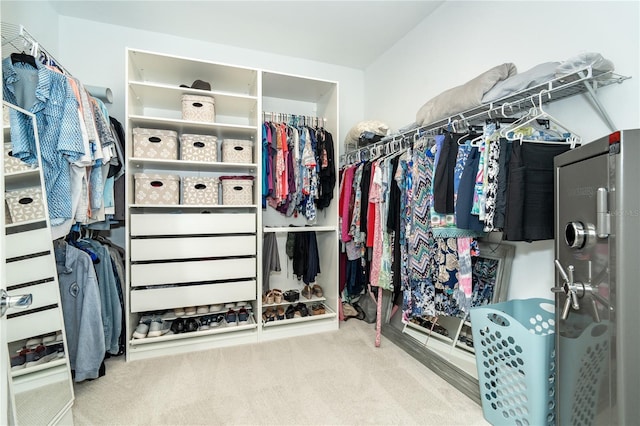 walk in closet featuring carpet