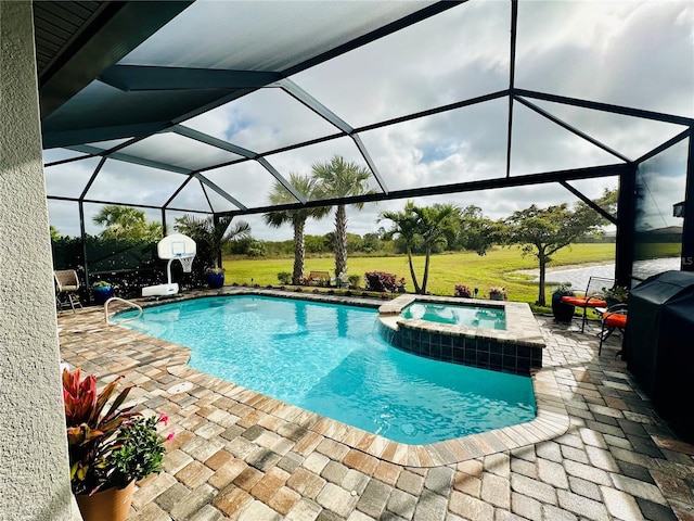 view of swimming pool with glass enclosure, a pool with connected hot tub, a patio area, and a yard