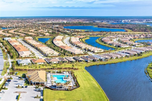 bird's eye view with a water view and a residential view