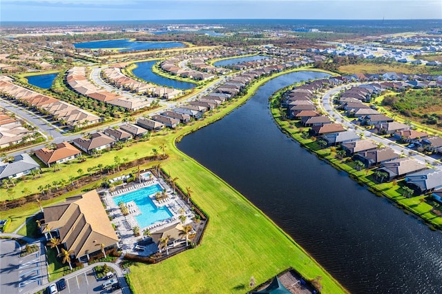 birds eye view of property with a water view and a residential view