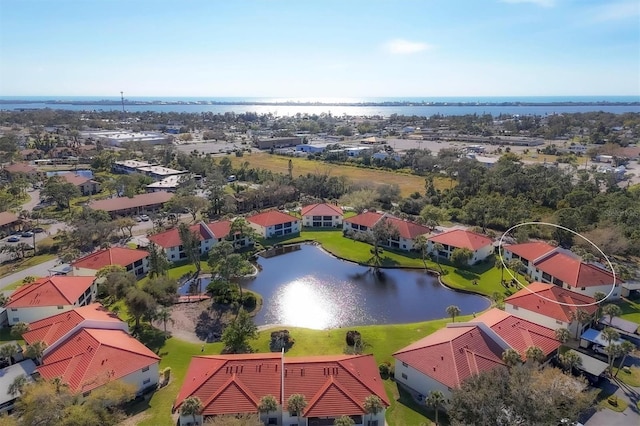 birds eye view of property featuring a water view