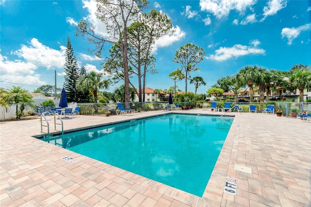 view of swimming pool with a patio