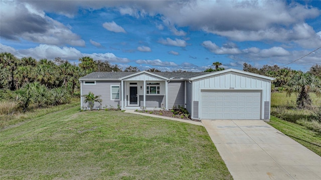 view of front facade with a front yard and a garage