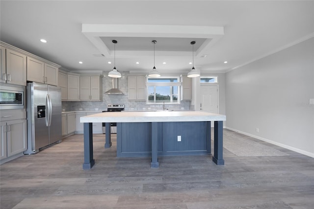 19196 Raymond Ave, Port Charlotte, FL 33954 - kitchen featuring stainless steel appliances, wall chimney exhaust hood, gray cabinets, tasteful backsplash, and ornamental molding