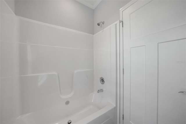 19196 Raymond Ave, Port Charlotte, FL 33954 - bathroom featuring washtub / shower combination and crown molding