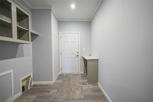19196 Raymond Ave, Port Charlotte, FL 33954 - washroom with crown molding, wood finished floors, and baseboards