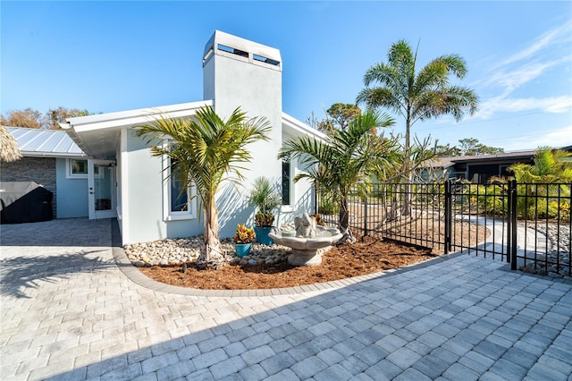 view of side of home with a patio