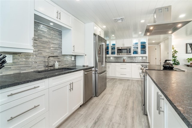 kitchen featuring appliances with stainless steel finishes, sink, and white cabinets