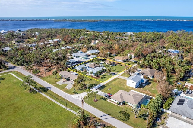 birds eye view of property with a water view