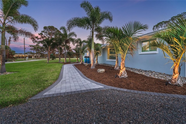 view of home's community featuring a lawn