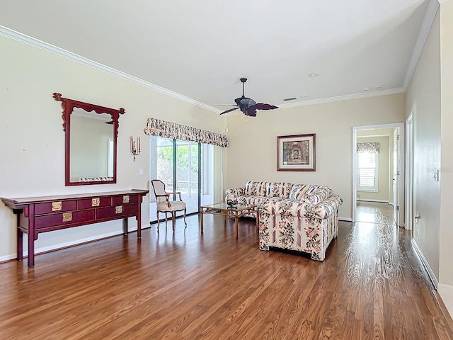 living room with crown molding, hardwood / wood-style flooring, and ceiling fan