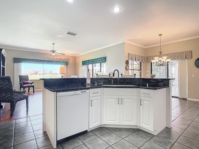 kitchen with crown molding, white dishwasher, an island with sink, and white cabinets