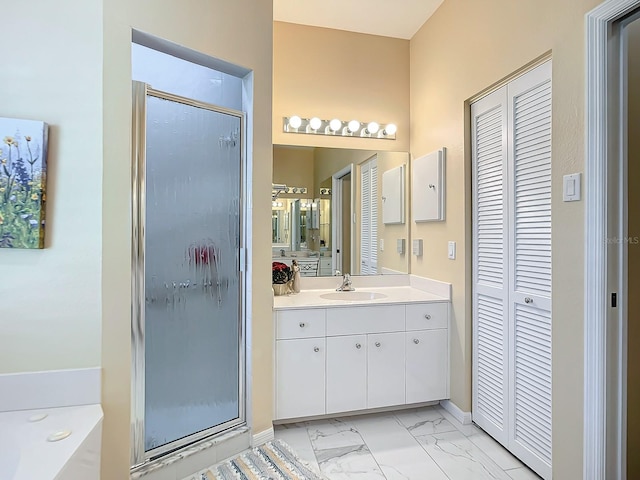 bathroom with vanity and separate shower and tub