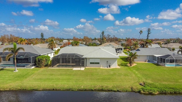 drone / aerial view with a water view