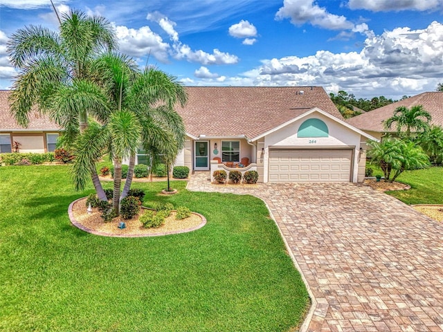 ranch-style house featuring a front yard and a garage