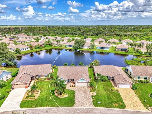 birds eye view of property with a water view