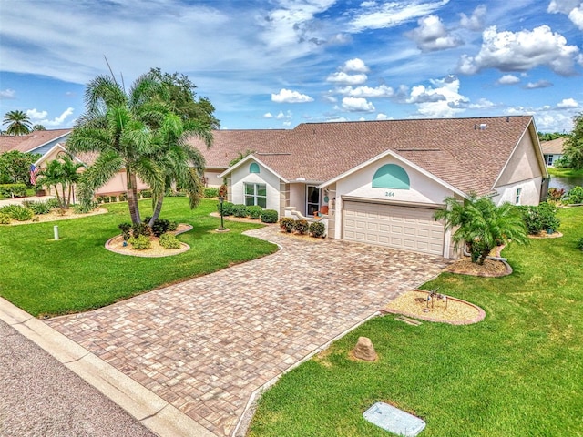 view of front of house with a front lawn and a garage