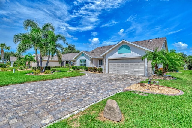 ranch-style home featuring a front yard and a garage