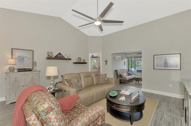 living room featuring ceiling fan, high vaulted ceiling, and wood-type flooring