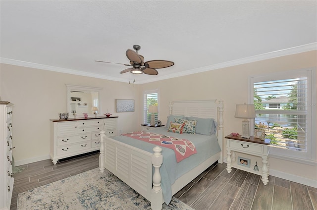 bedroom with ceiling fan, multiple windows, and dark hardwood / wood-style floors