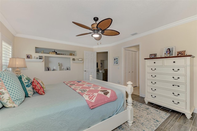 bedroom with dark hardwood / wood-style flooring, crown molding, a closet, and ceiling fan