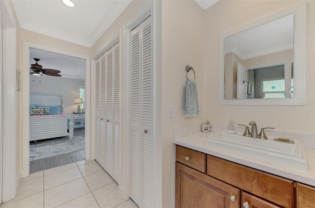 bathroom with vanity, crown molding, wood-type flooring, and ceiling fan