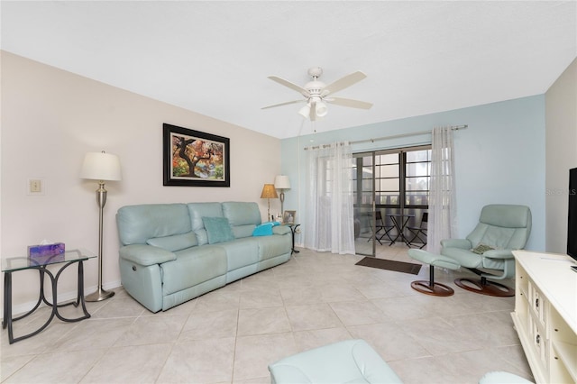 tiled living room with ceiling fan