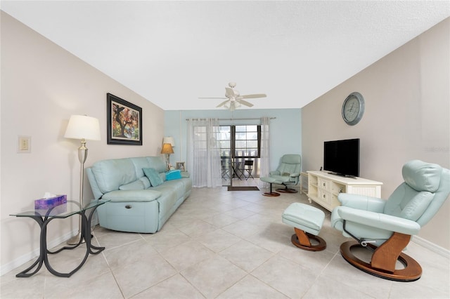 tiled living room featuring ceiling fan