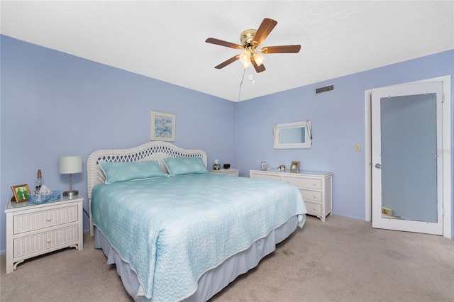 bedroom with light colored carpet and ceiling fan