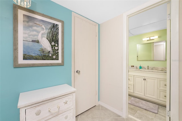 interior space with vanity and tile patterned flooring