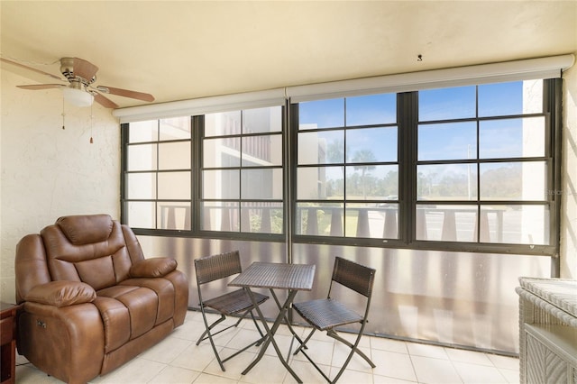 living area with ceiling fan