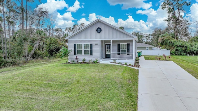 view of front of property with a front yard and a porch