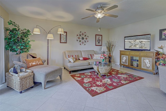 tiled living room with ceiling fan